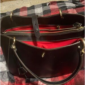 Dooney &Bourke alto black   Reg 700.   500 for sale It’s like new